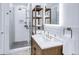 Modern bathroom featuring updated vanity with shelving, a glass shower, and modern fixtures at 45 Ivan Allen Jr Nw Blvd # 1704, Atlanta, GA 30308