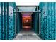 Stylish entrance corridor with decorative panels and a glass door leading to a warm interior at 45 Ivan Allen Jr Nw Blvd # 1704, Atlanta, GA 30308