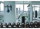 Gym featuring workout equipment, free weights, and views of the city at 45 Ivan Allen Jr Nw Blvd # 1704, Atlanta, GA 30308
