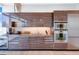 Contemporary kitchen featuring sleek wood cabinetry, stainless steel appliances, and modern finishes at 45 Ivan Allen Jr Nw Blvd # 1704, Atlanta, GA 30308