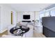 Bright living area with a dining table, comfortable seating, and expansive windows with cityscape views at 45 Ivan Allen Jr Nw Blvd # 1704, Atlanta, GA 30308
