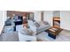 Open-concept living area with a modern kitchen, cozy seating, and large windows offering city views at 45 Ivan Allen Jr Nw Blvd # 1704, Atlanta, GA 30308