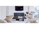 Modern living room with stylish furniture, a large TV, and floor-to-ceiling windows offering cityscape views at 45 Ivan Allen Jr Nw Blvd # 1704, Atlanta, GA 30308