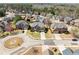 Real estate showcasing a neighborhood with well-manicured lawns, mature trees, and inviting homes at 50 Riverstone Dr, Covington, GA 30014