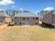 Spacious backyard featuring a well-maintained lawn and a patio, perfect for outdoor entertaining and Gathering activities at 50 Riverstone Dr, Covington, GA 30014