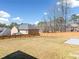 Large, fenced backyard with green grass, offering plenty of space for outdoor activities and relaxation at 50 Riverstone Dr, Covington, GA 30014