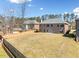 Expansive backyard with a wooden fence, providing privacy and security for outdoor enjoyment and recreation at 50 Riverstone Dr, Covington, GA 30014