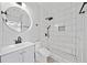 Modern bathroom with white subway tile shower, hexagon tile floor, and stylish vanity at 50 Riverstone Dr, Covington, GA 30014