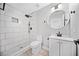 Modern bathroom featuring a walk-in shower with stylish black fixtures and a sleek vanity at 50 Riverstone Dr, Covington, GA 30014