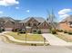 Beautiful brick home features a well-manicured lawn, two-car garage, and classic architectural details at 50 Riverstone Dr, Covington, GA 30014
