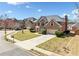 Charming brick home with a well-maintained lawn, spacious driveway, and attractive curb appeal at 50 Riverstone Dr, Covington, GA 30014