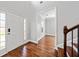 Inviting foyer featuring hardwood floors, a bright entrance, and easy access to other rooms at 50 Riverstone Dr, Covington, GA 30014