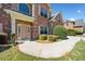 Charming brick home showcasing a welcoming front entrance with a well-manicured lawn and a concrete walkway at 50 Riverstone Dr, Covington, GA 30014