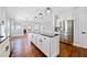 Bright, updated kitchen features a central island, stainless steel appliances, and open layout at 50 Riverstone Dr, Covington, GA 30014