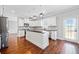 Well-lit kitchen with white cabinets, stainless steel appliances, and an island at 50 Riverstone Dr, Covington, GA 30014