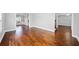 Bright open-concept living room featuring hardwood floors and neutral paint, ready for personal touches at 50 Riverstone Dr, Covington, GA 30014