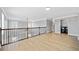Open loft space overlooking the living room offers hardwood floors and provides access to the laundry area at 50 Riverstone Dr, Covington, GA 30014