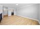 Bright loft space overlooking the living area features light-colored hardwood floors and nearby laundry room at 50 Riverstone Dr, Covington, GA 30014