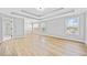 Large main bedroom features hardwood floors, tray ceiling, bright windows, and ensuite bath access at 50 Riverstone Dr, Covington, GA 30014