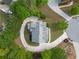 Aerial view of the home showcasing its large lot, circular driveway, and mature trees at 711 Wilhaven Ct, Loganville, GA 30052