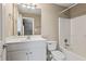 This full bathroom offers a single vanity, a large mirror, and a shower-tub combination at 711 Wilhaven Ct, Loganville, GA 30052