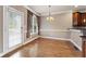 Dining room features hardwood floors and natural light from the door and windows at 711 Wilhaven Ct, Loganville, GA 30052