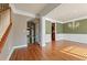 A dining room featuring hardwood floors, green walls, white molding, and a chandelier at 711 Wilhaven Ct, Loganville, GA 30052