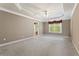 Spacious main bedroom with a tray ceiling, plush carpet and lots of natural light at 711 Wilhaven Ct, Loganville, GA 30052