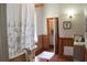 Charming bathroom featuring a clawfoot tub, wood paneling and decorative elements at 885 White Sw St, Atlanta, GA 30310