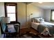 Inviting bedroom with cozy bedding, a study area, and great natural lighting at 885 White Sw St, Atlanta, GA 30310