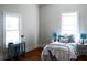 Bright bedroom featuring hardwood floors, ample natural light and cozy furnishings at 885 White Sw St, Atlanta, GA 30310
