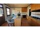 Kitchen features light cabinets, granite countertops, and an open dining area at 885 White Sw St, Atlanta, GA 30310