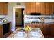 Well-equipped kitchen with granite countertops, tile backsplash, and stainless steel appliances at 885 White Sw St, Atlanta, GA 30310