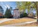 Spacious backyard featuring a deck, basketball hoop and ample space for outdoor activities at 3491 Falls Branch Ct, Buford, GA 30519