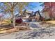 Charming curb appeal with a circular driveway and well-maintained landscaping, showcasing the home's inviting exterior at 3491 Falls Branch Ct, Buford, GA 30519