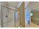 Bathroom with glass shower and white tile tub surround at 4590 Carver Ct, Cumming, GA 30040