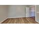 Neutral bedroom features wood-look floors and a white baseboard trim at 4590 Carver Ct, Cumming, GA 30040