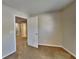 Bedroom showcases carpet, neutral walls and an open doorway at 4590 Carver Ct, Cumming, GA 30040