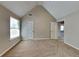 Bedroom showcases vaulted ceilings, large windows and neutral walls at 4590 Carver Ct, Cumming, GA 30040