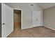 Bedroom features plush carpet, white trim and an open doorway at 4590 Carver Ct, Cumming, GA 30040