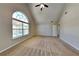 Bright bedroom boasts vaulted ceilings and large arched window at 4590 Carver Ct, Cumming, GA 30040