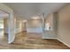 Open concept dining area with wood-look flooring and wainscoting at 4590 Carver Ct, Cumming, GA 30040