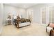 Simple bedroom with natural light and large bed and chair at 5395 Steeple Chase, Douglasville, GA 30135