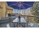 Outdoor deck features seating with a glass-topped table with a blue umbrella, providing a relaxing space at 5395 Steeple Chase, Douglasville, GA 30135