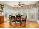 Sun-drenched kitchen dining area with expansive windows and wooden table set at 5395 Steeple Chase, Douglasville, GA 30135