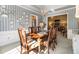 Classic dining room with wood table set, decorative wall plates, and sunlit interiors at 5395 Steeple Chase, Douglasville, GA 30135