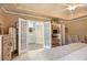 Serene main bedroom with a view of the bathroom, soft lighting and cozy furniture at 5395 Steeple Chase, Douglasville, GA 30135