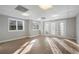 Bright basement featuring sunlit windows and double doors, enhancing the living space with natural light and outdoor access at 740 Frank Kirk Nw Rd, Kennesaw, GA 30152