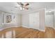 Bedroom featuring hardwood floors, a ceiling fan and trim at 740 Frank Kirk Nw Rd, Kennesaw, GA 30152