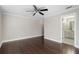 Bedroom featuring hardwood floors, a ceiling fan and trim at 740 Frank Kirk Nw Rd, Kennesaw, GA 30152